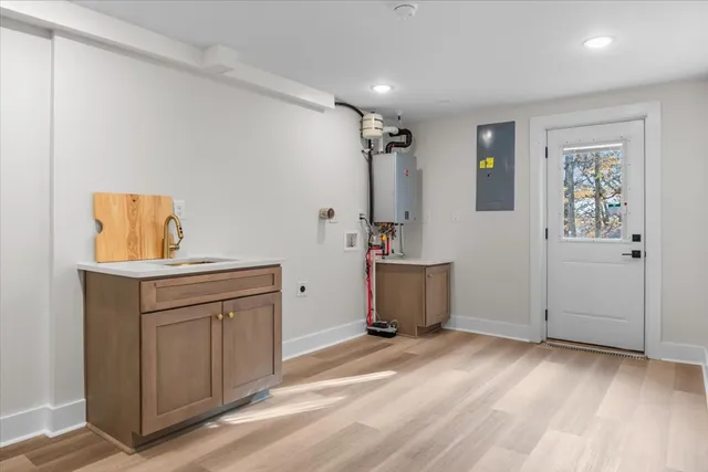 a view of a kitchen with storage and utility
