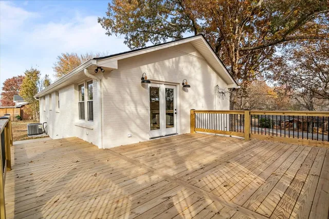 a backyard of a house with wooden floor yard and outdoor seating