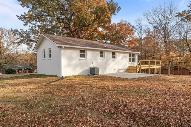 a front view of house with yard and trees