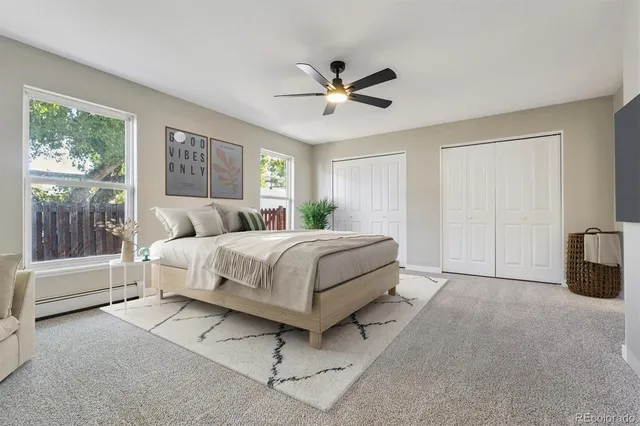 a bedroom with a bed and glass walk in closet