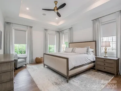 a spacious bedroom with a bed and a couch