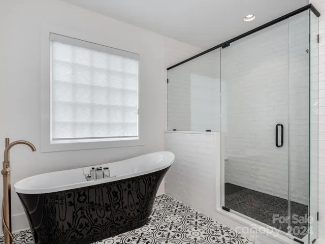 a bathroom with a sink and a shower