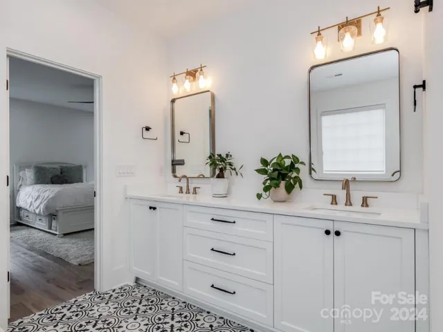 a bathroom with a sink vanity and mirror