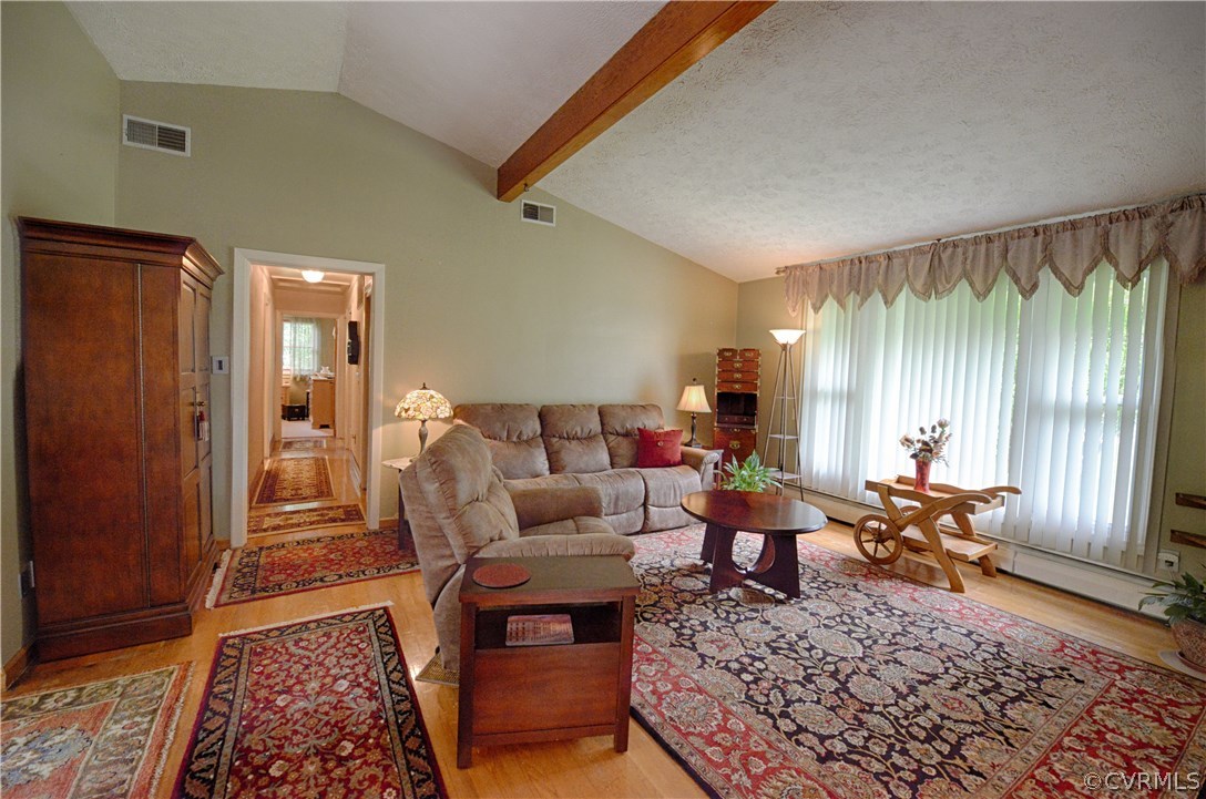7706 Anoka Road Henrico, VA 23229 - Photo 2 of 26 The large family room features a vaulted ceiling,