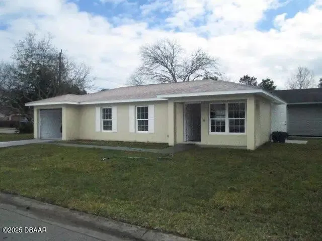 a house view with a garden space