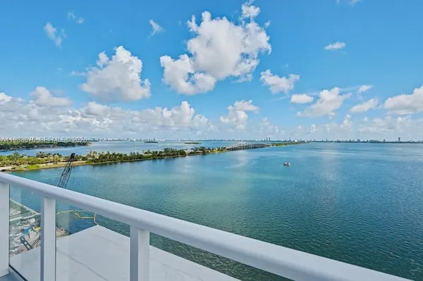 a view of a lake from a balcony