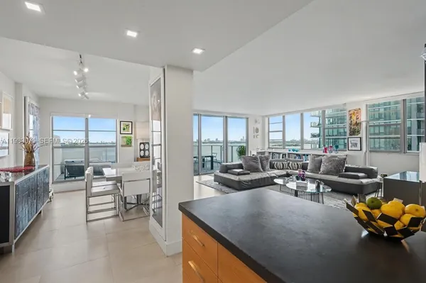 a living room with furniture and a large window