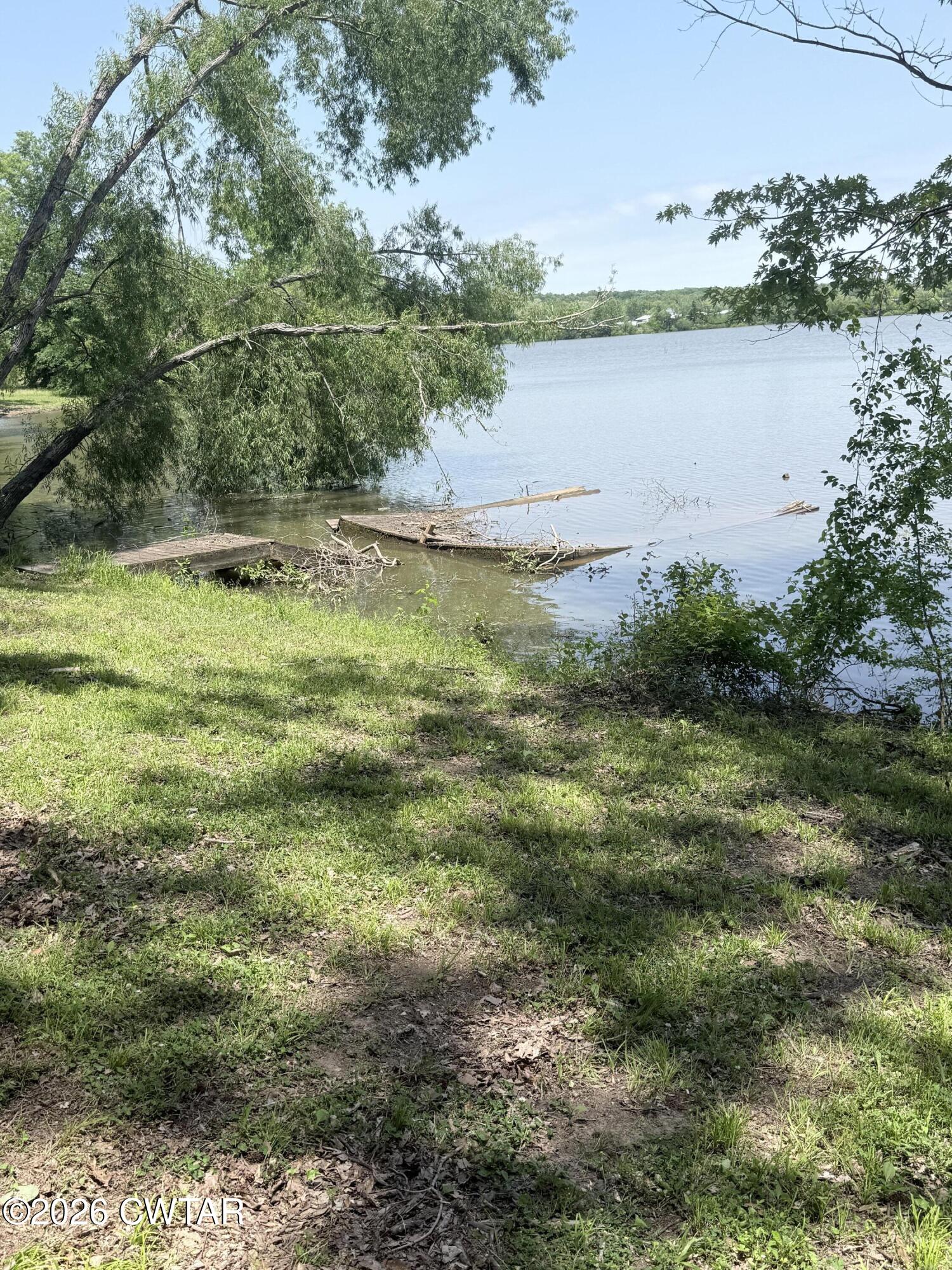 1060 Lost Creek Boat Dock Road Decaturville, TN 38329 - Photo 13 of 40 a view of a lake from a yard