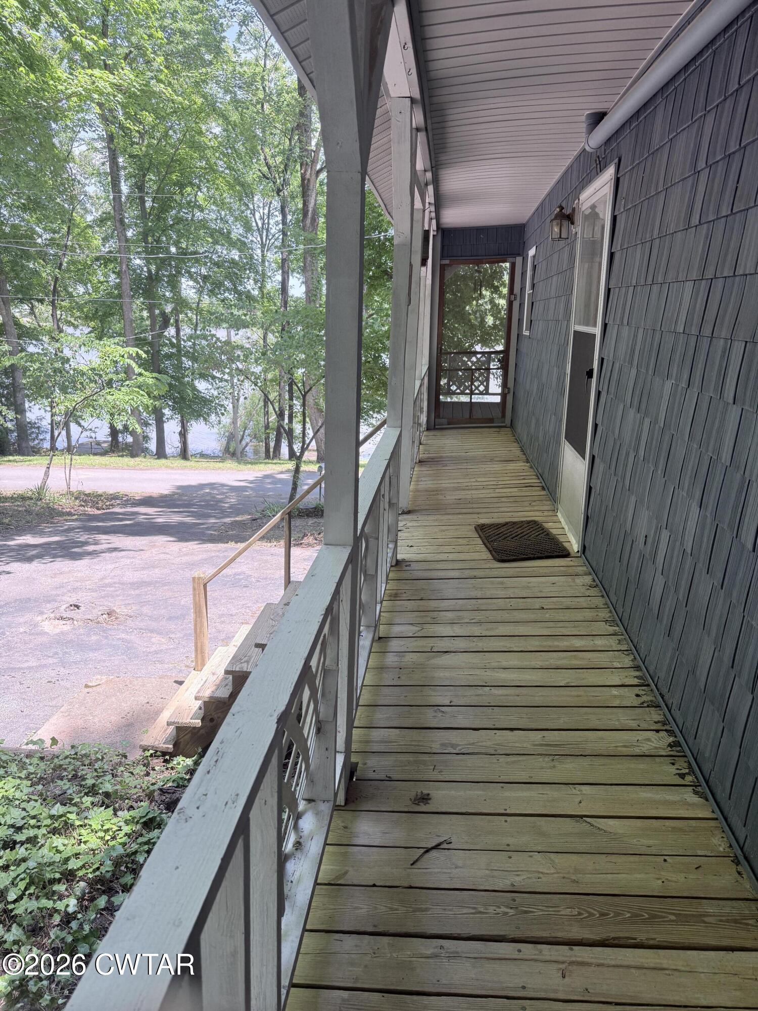 1060 Lost Creek Boat Dock Road Decaturville, TN 38329 - Photo 16 of 40 a view of a balcony with wooden floor