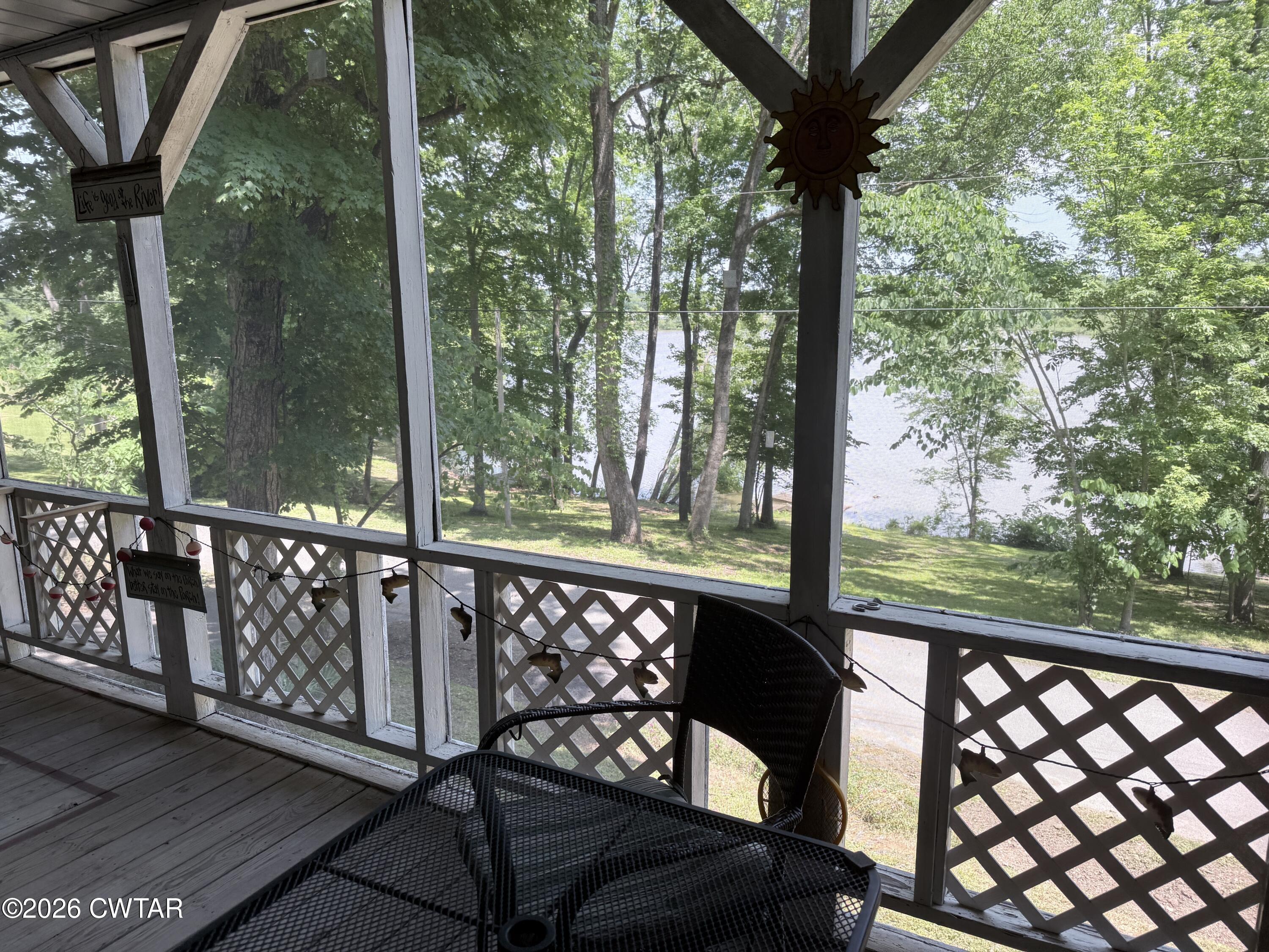 1060 Lost Creek Boat Dock Road Decaturville, TN 38329 - Photo 19 of 40 a view of a bench in the balcony