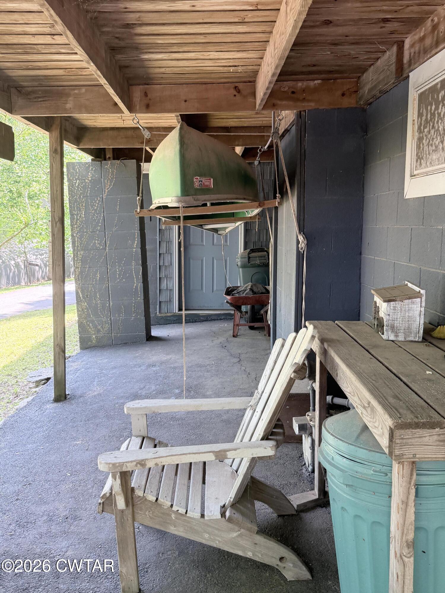 1060 Lost Creek Boat Dock Road Decaturville, TN 38329 - Photo 22 of 40 a view of a balcony with chairs