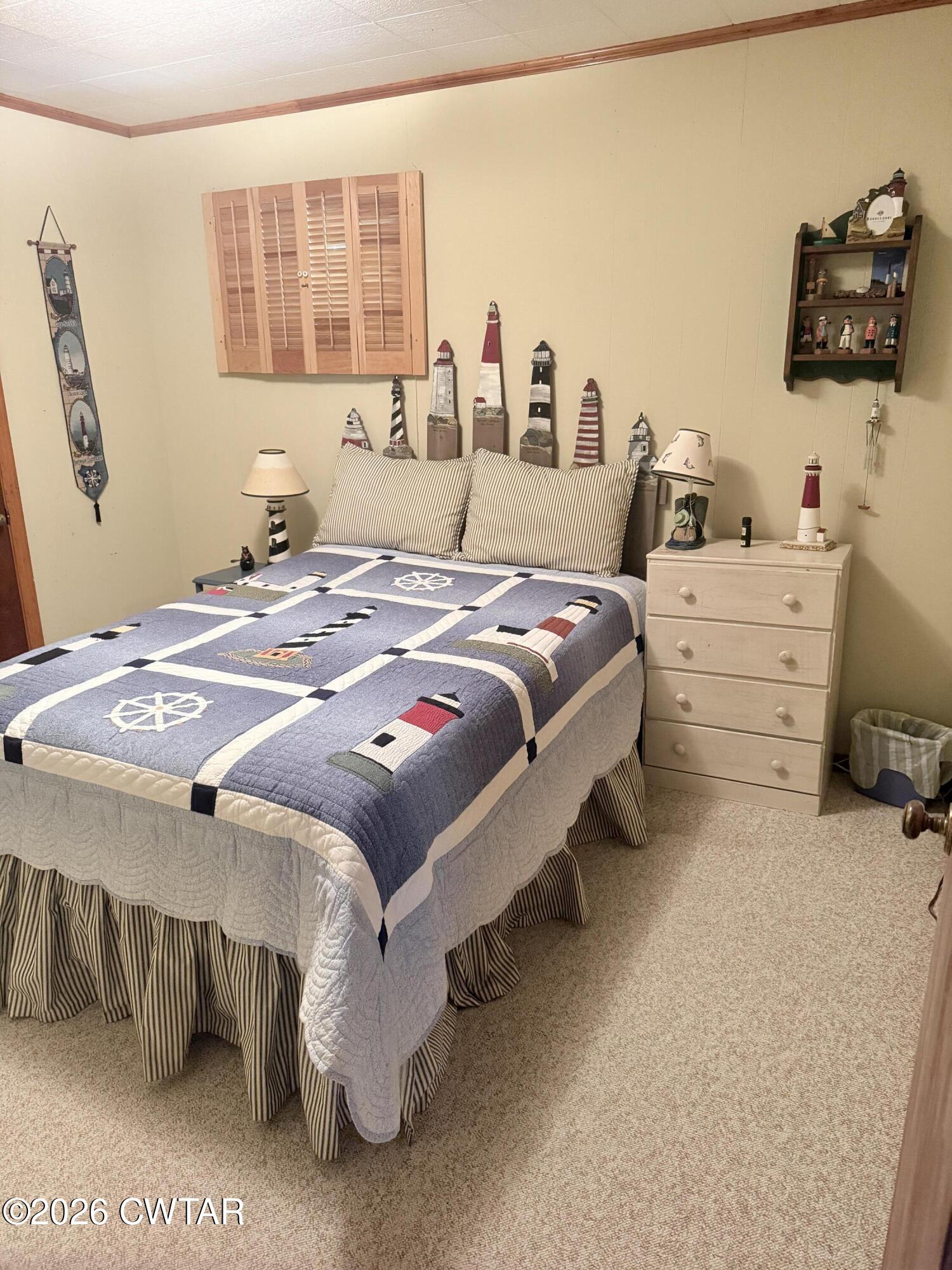 1060 Lost Creek Boat Dock Road Decaturville, TN 38329 - Photo 33 of 40 a bedroom with bed and window