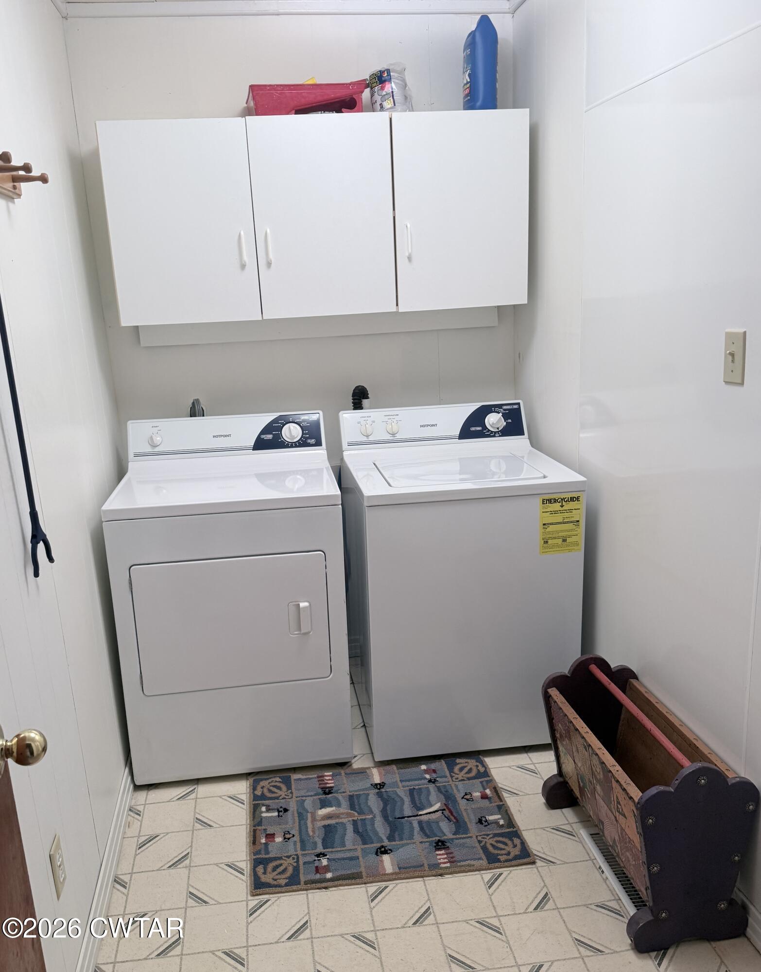 1060 Lost Creek Boat Dock Road Decaturville, TN 38329 - Photo 36 of 40 a utility room with dryer and washer