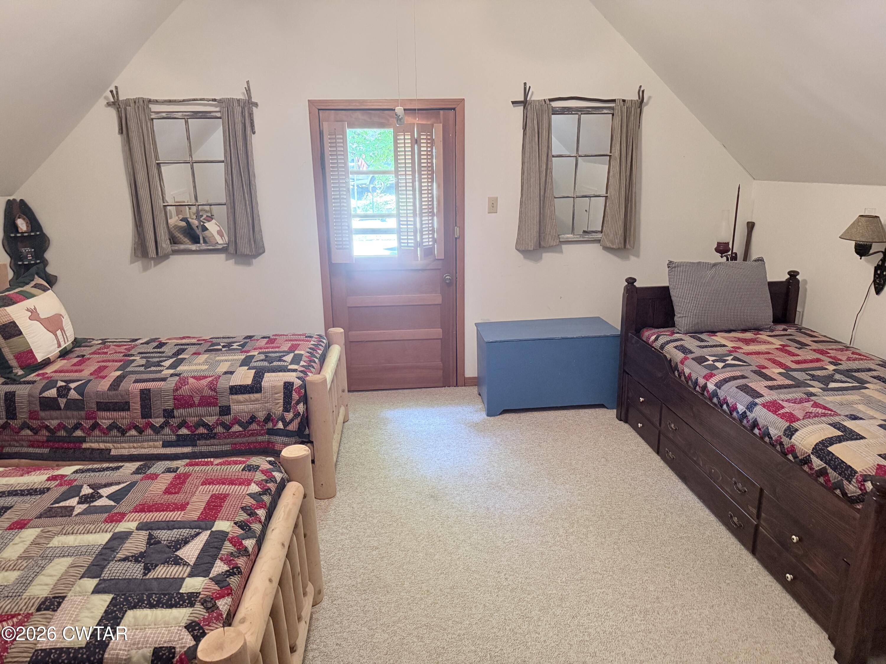 1060 Lost Creek Boat Dock Road Decaturville, TN 38329 - Photo 39 of 40 a bedroom with a bed and window