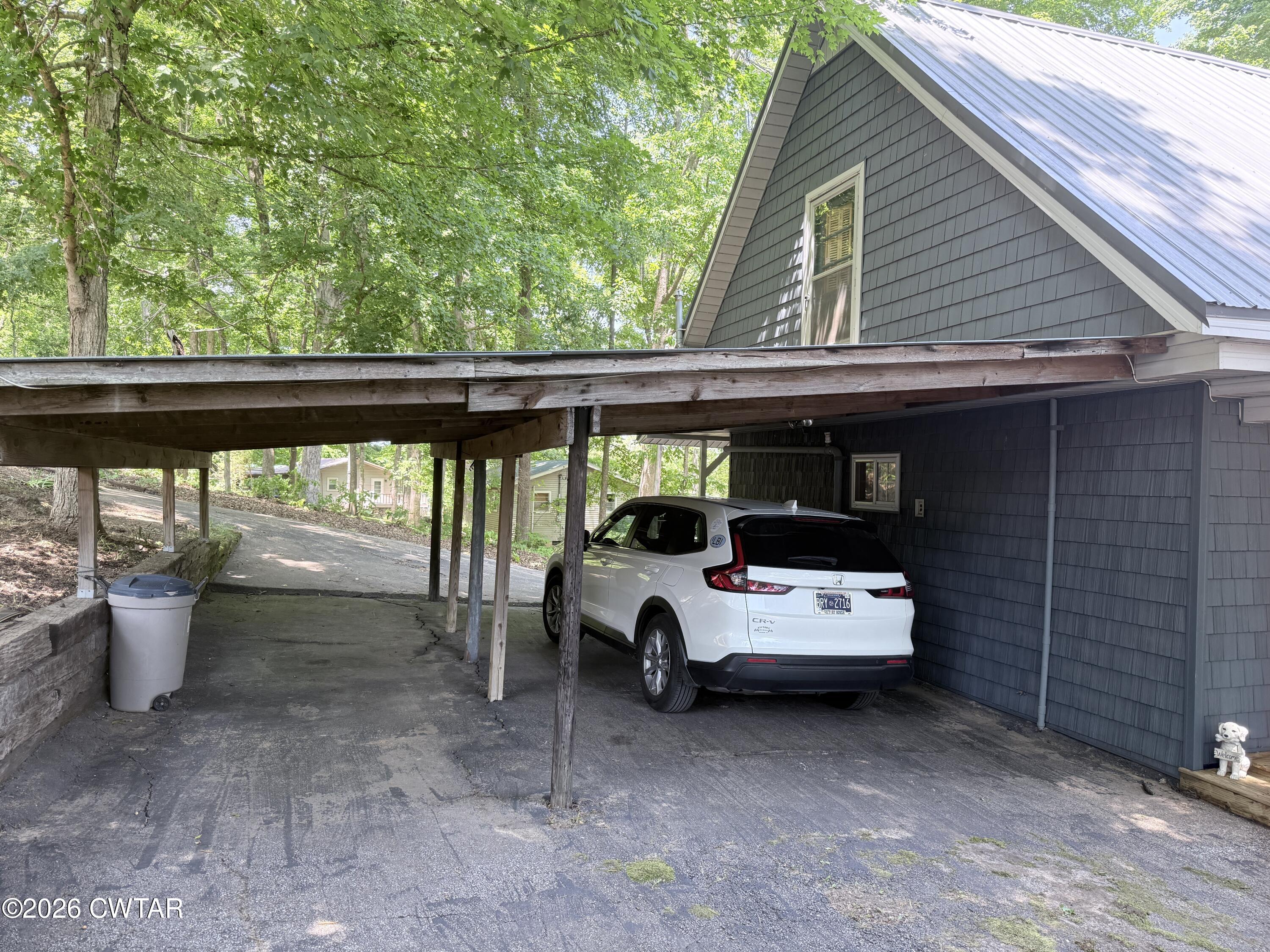 1060 Lost Creek Boat Dock Road Decaturville, TN 38329 - Photo 7 of 40 a view of outdoor space with porch and outdoor seating