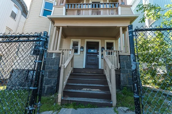 a front view of a house with a porch