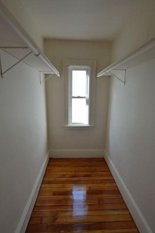 7 Topliff Street, Unit 1 Boston, MA 02122 - Photo 15 of 25 a view of room with window and hardwood floor