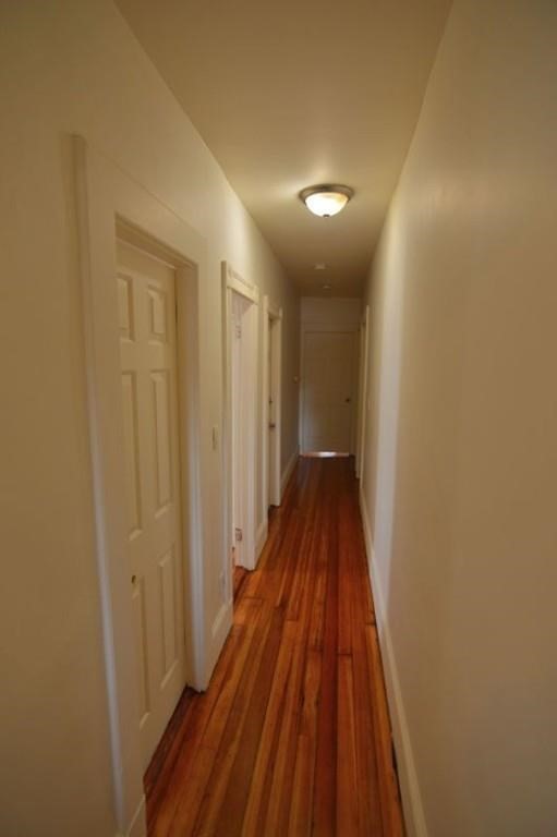 7 Topliff Street, Unit 1 Boston, MA 02122 - Photo 20 of 25 a view of a hallway with wooden floor