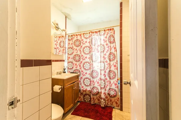 a bathroom with a shower and a sink