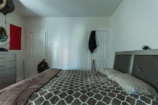 a bedroom with a bed and a view