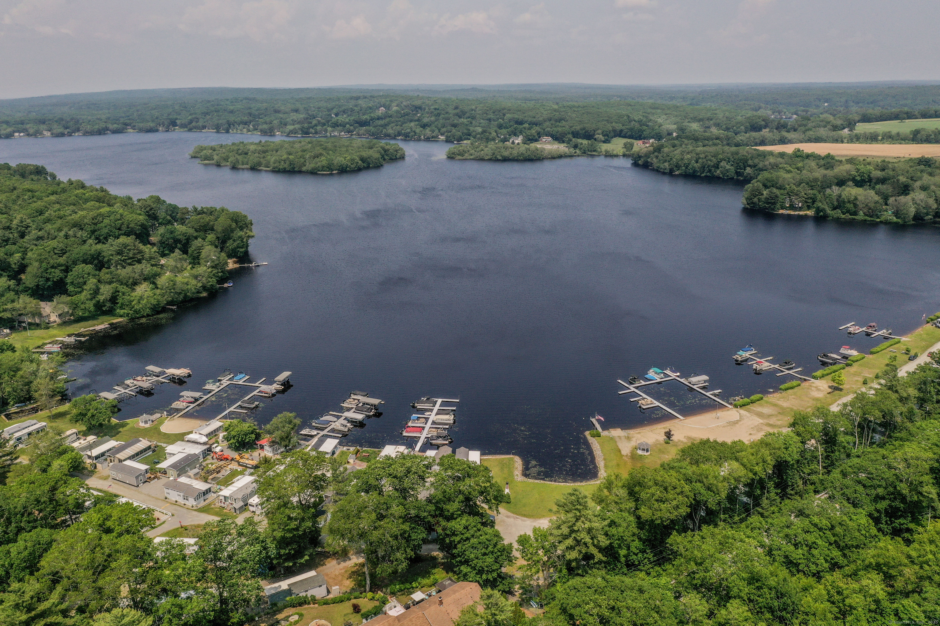 262 Shetucket Turnpike, Unit 2 Griswold, CT 06351 - Photo 24 of 26 an aerial view of a house with a yard and lake view