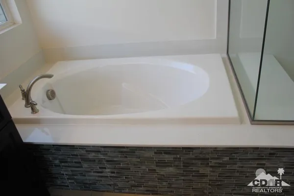 a bathroom with a sink and a shower