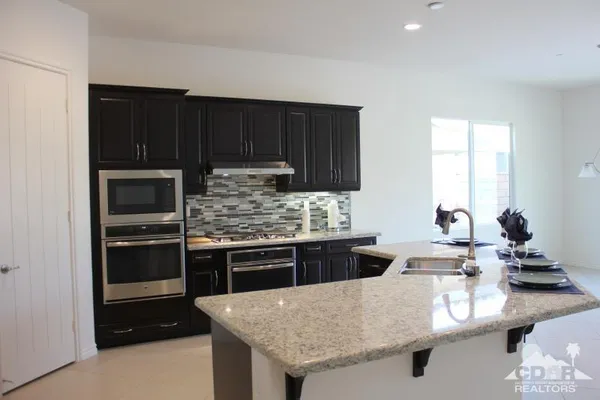 a living room with hardwood floor and windows