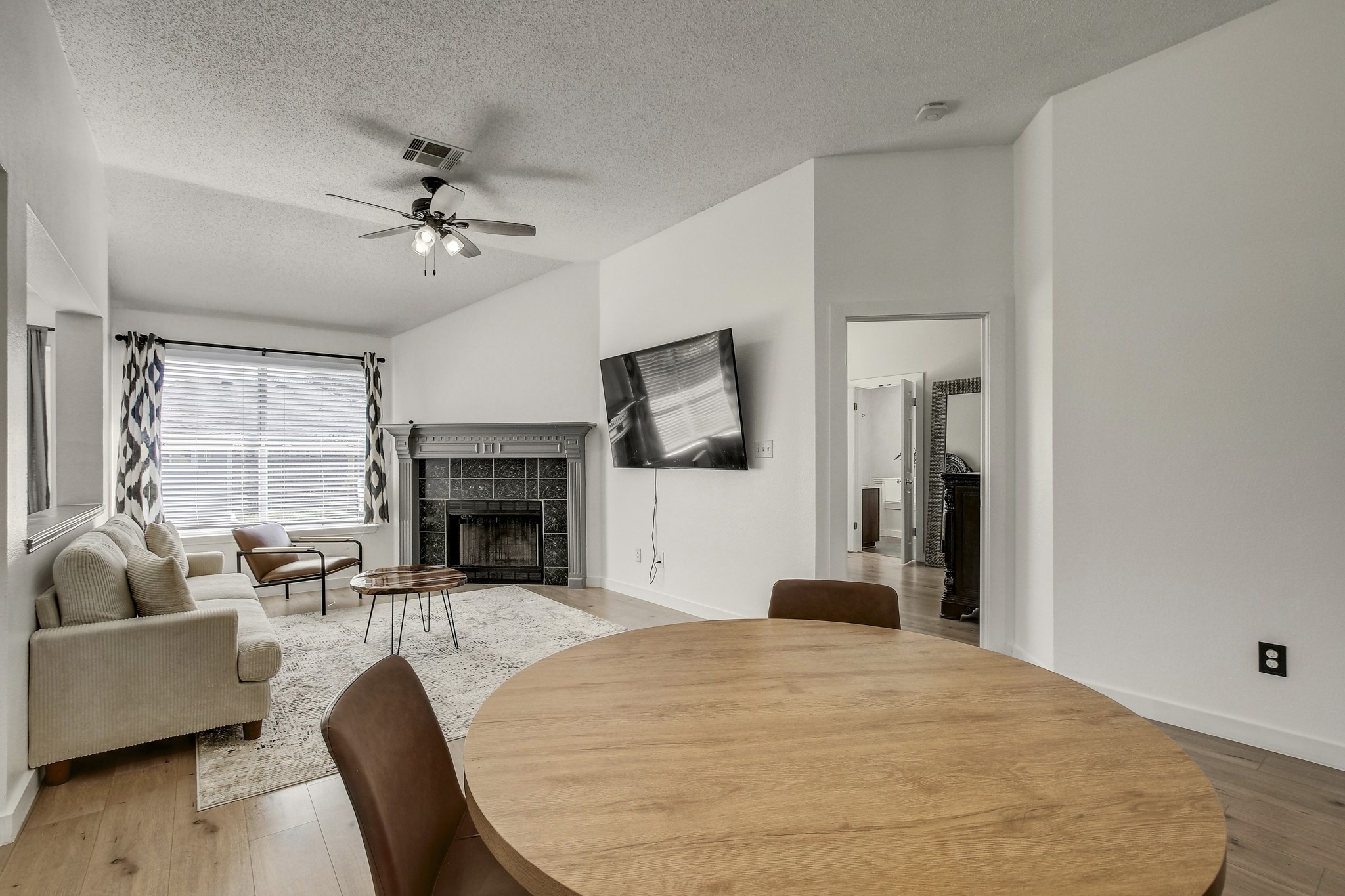 806 Ridge View Drive Leander, TX 78641 - Photo 12 of 30 a living room with furniture a fireplace and a flat screen tv