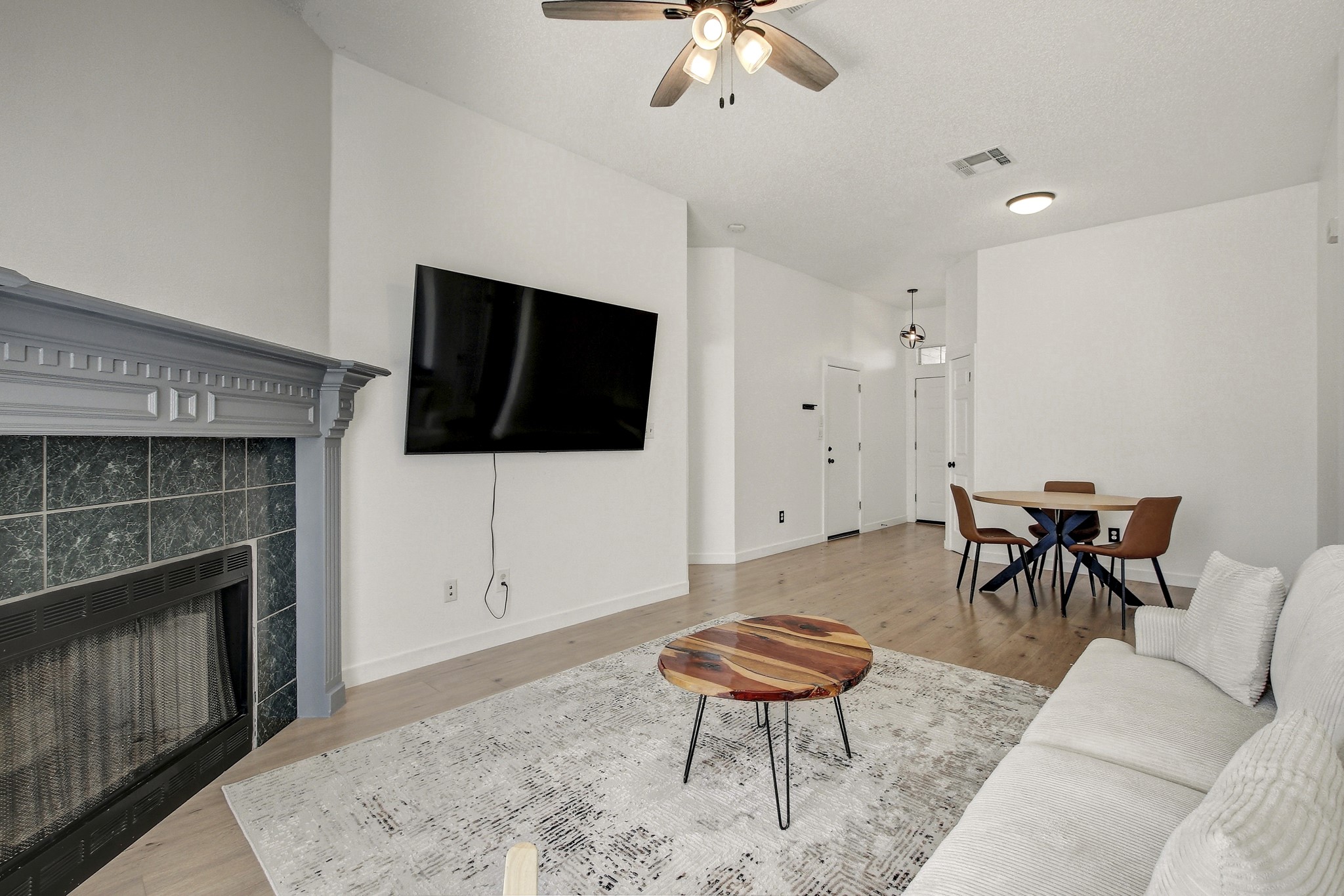 806 Ridge View Drive Leander, TX 78641 - Photo 13 of 30 a living room with furniture a flat screen tv and a fireplace