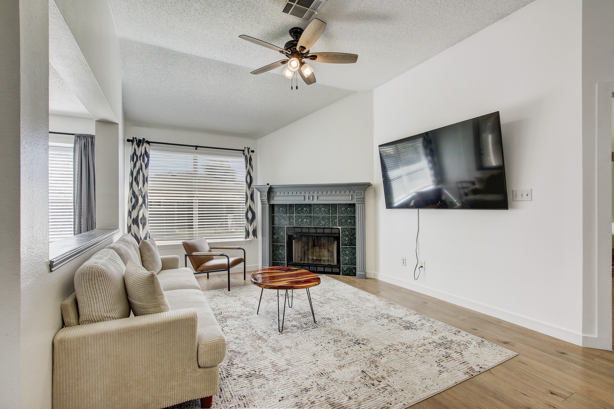 806 Ridge View Drive Leander, TX 78641 - Photo 14 of 30 a living room with furniture a flat screen tv and a fireplace