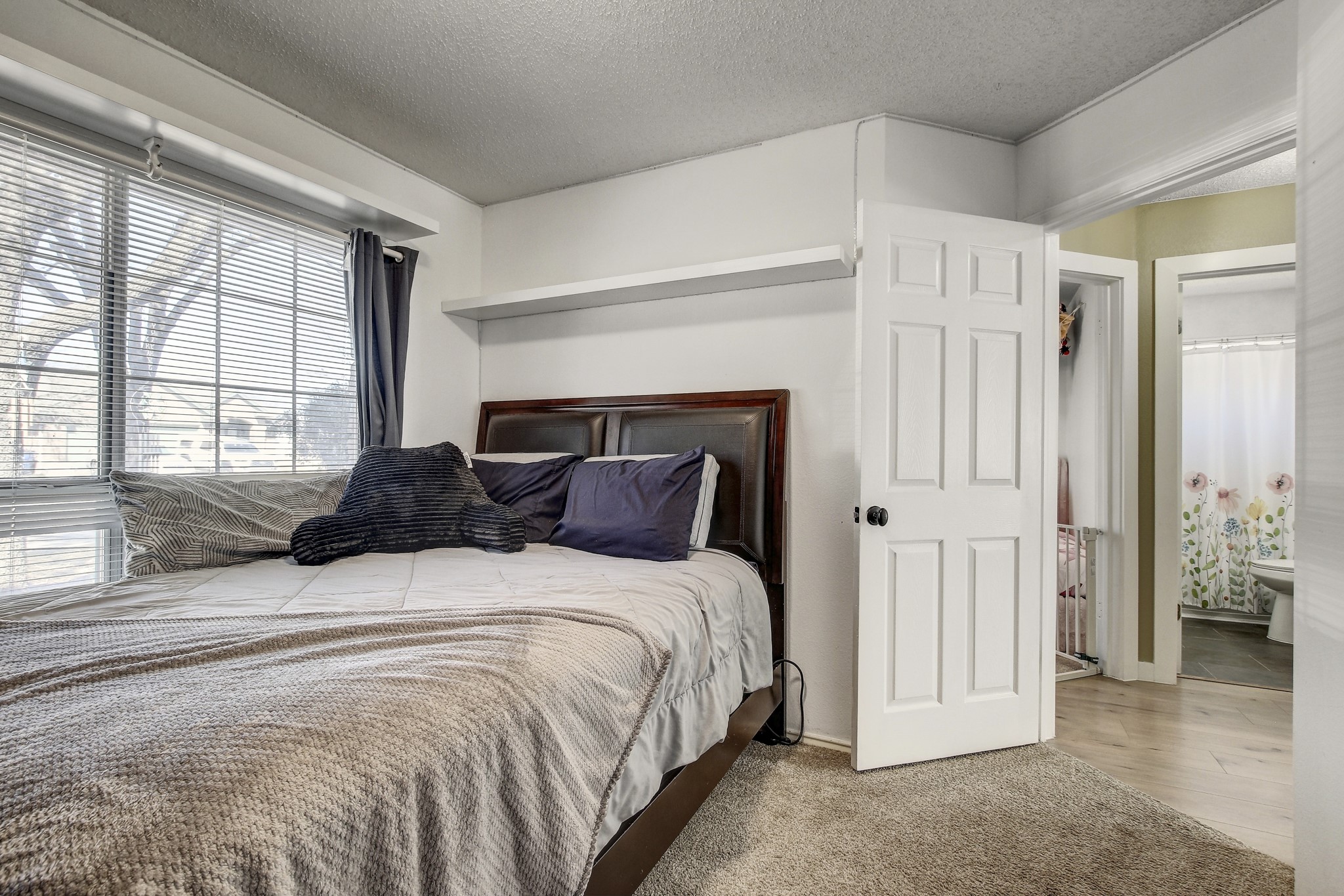 806 Ridge View Drive Leander, TX 78641 - Photo 25 of 30 a bedroom with a bed and a window