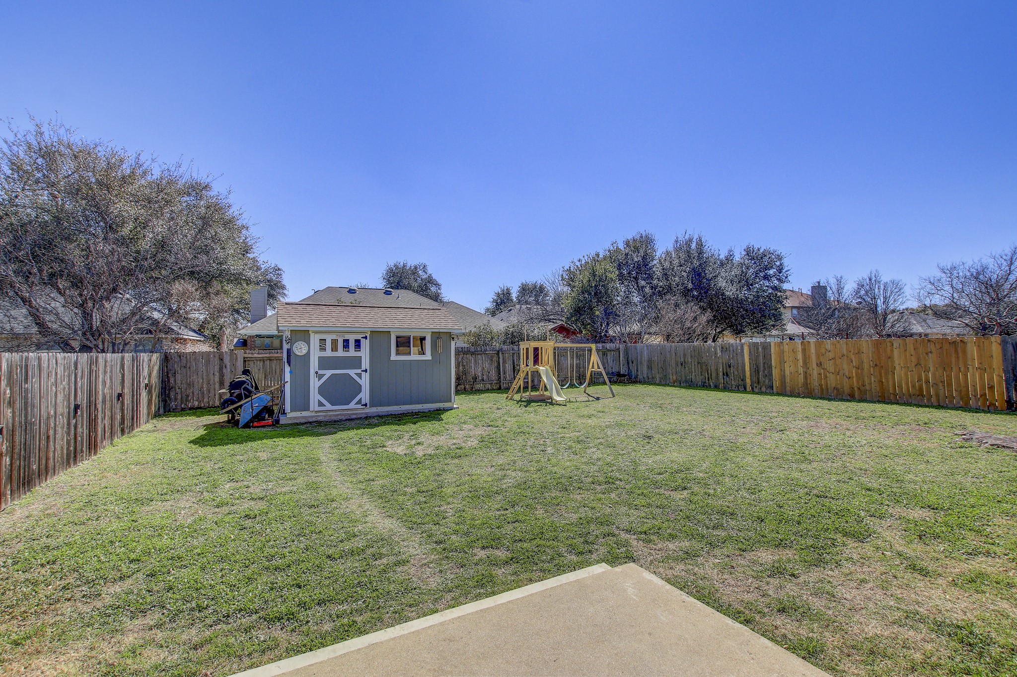 806 Ridge View Drive Leander, TX 78641 - Photo 30 of 30 a view of a house with a yard and a large tree