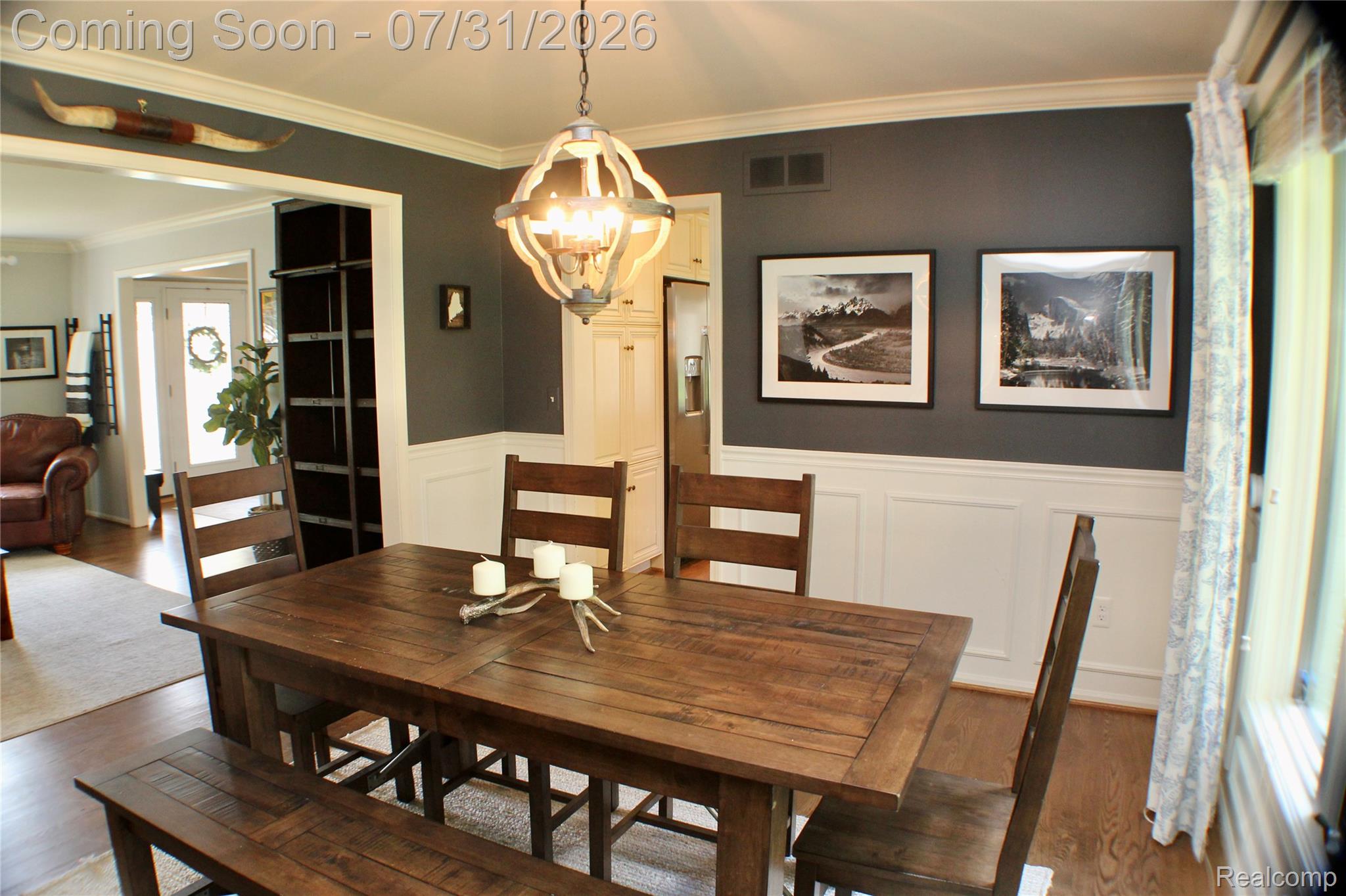 362 Lake Forest Road Rochester, MI 48309 - Photo 13 of 50 Dining area with two-tone wall treatment, featuring a dark upper wall and white wainscoting