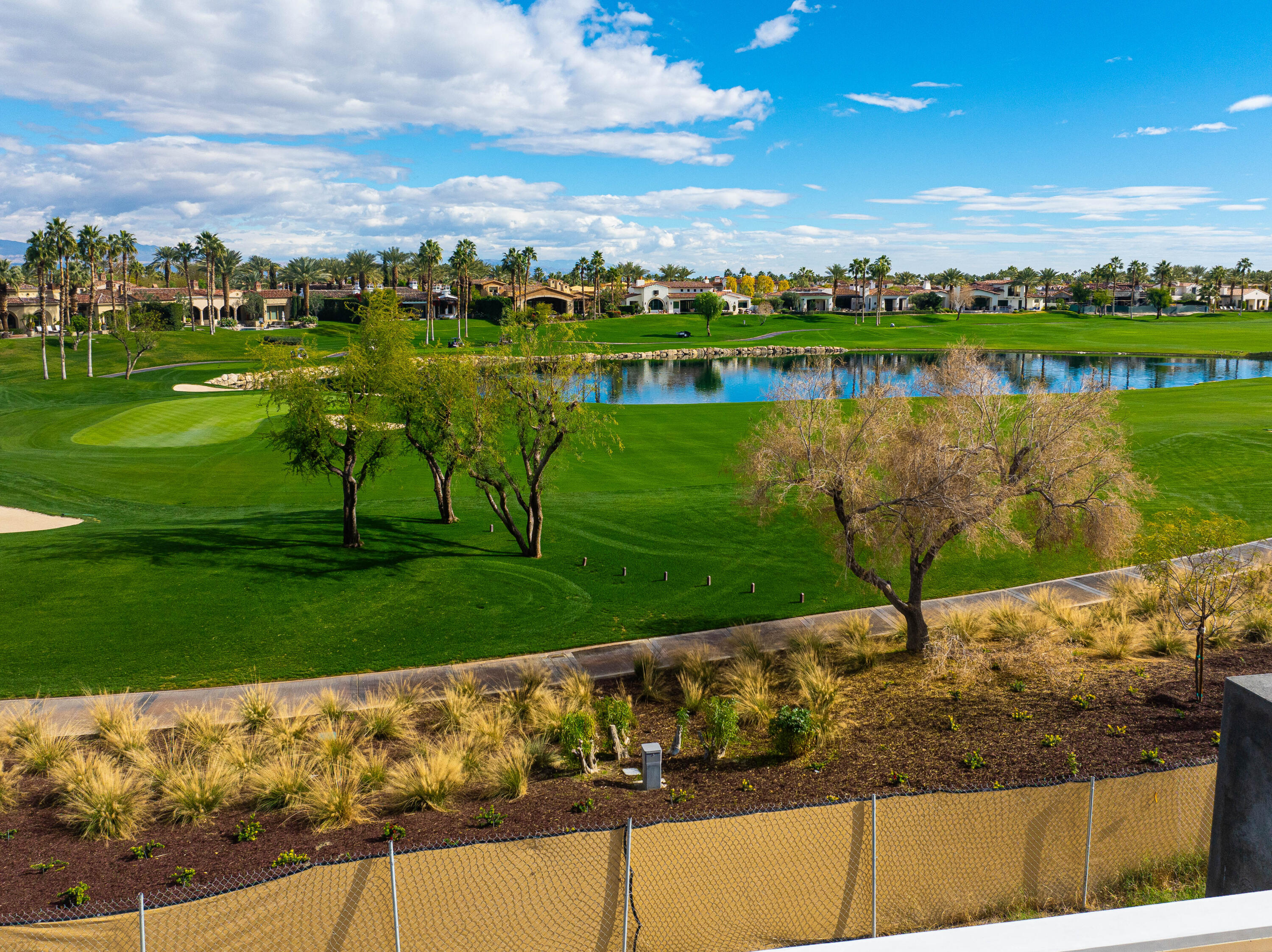 53320 Via Palacio La Quinta, CA 92253 - Photo 10 of 10 a view of a lake with houses in the back