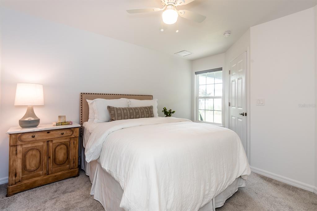 215 Lewis Circle, Unit 111 Punta Gorda, FL 33950 - Photo 19 of 43 a bedroom with a bed and a window