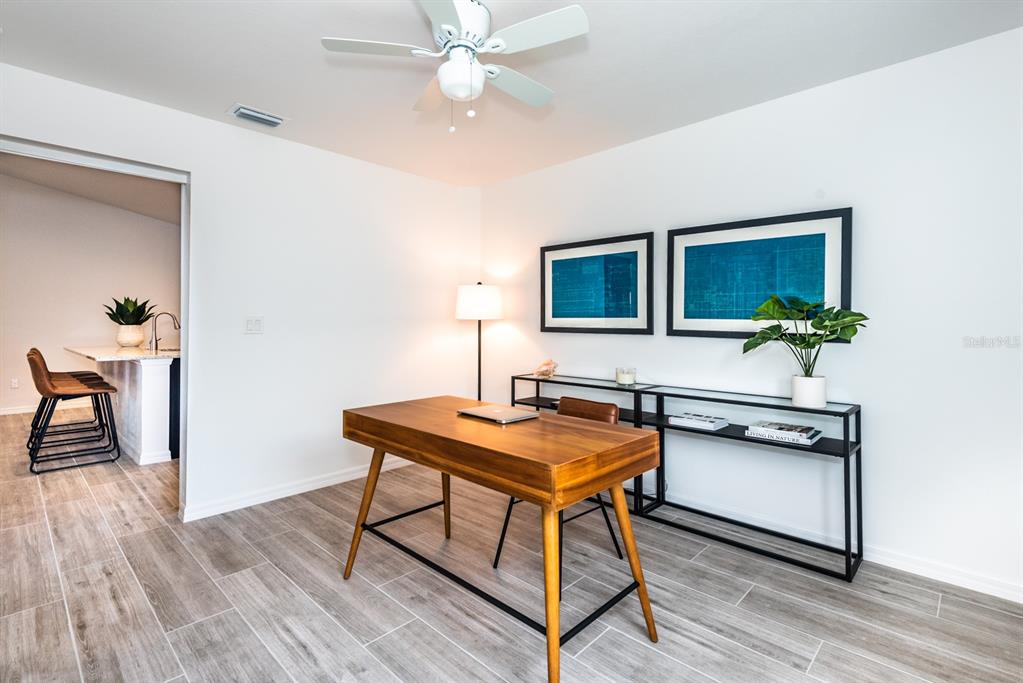 215 Lewis Circle, Unit 111 Punta Gorda, FL 33950 - Photo 25 of 43 a view of a workspace with furniture and wooden floor