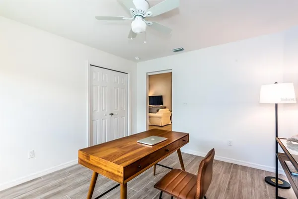 a room with furniture and wooden floor