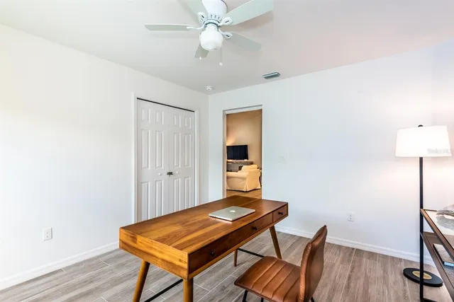a room with furniture and wooden floor