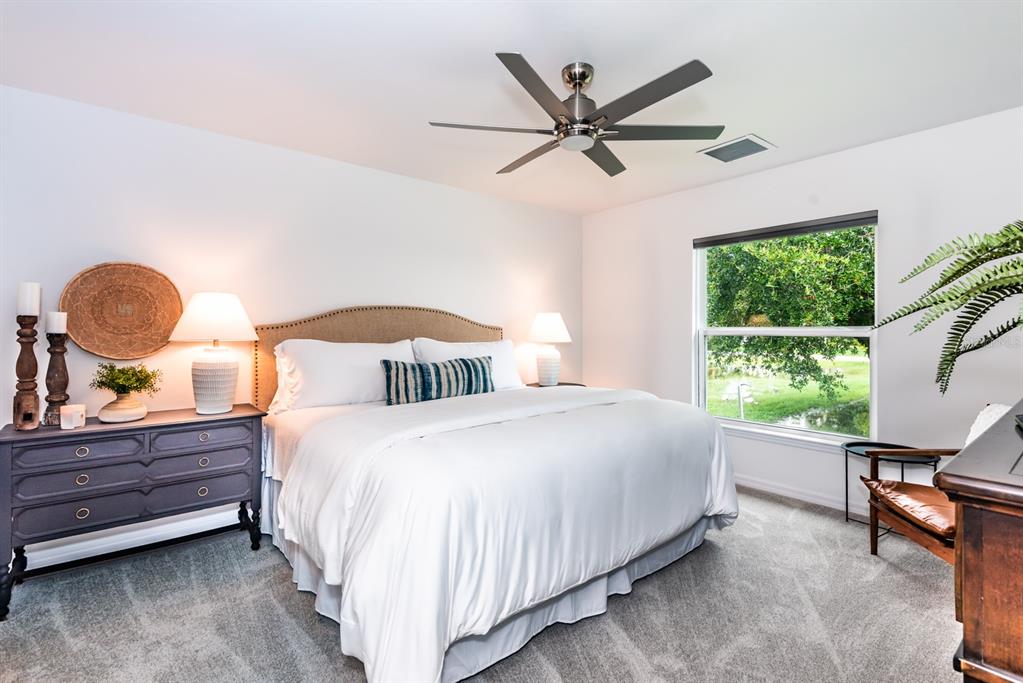 215 Lewis Circle, Unit 111 Punta Gorda, FL 33950 - Photo 28 of 43 a bedroom with a bed and window