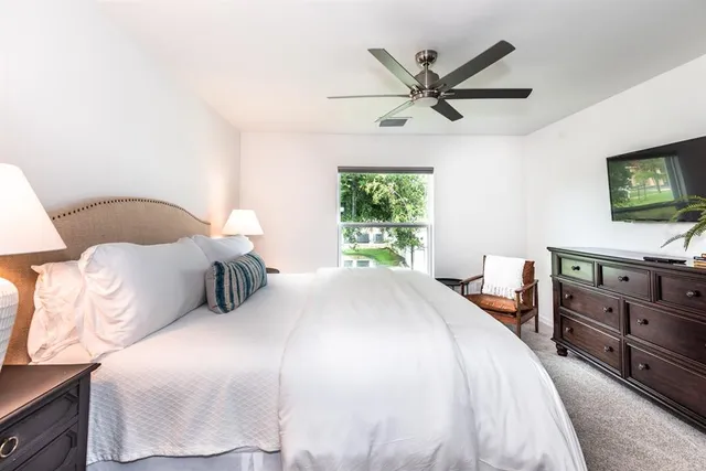 a bedroom with a bed and window