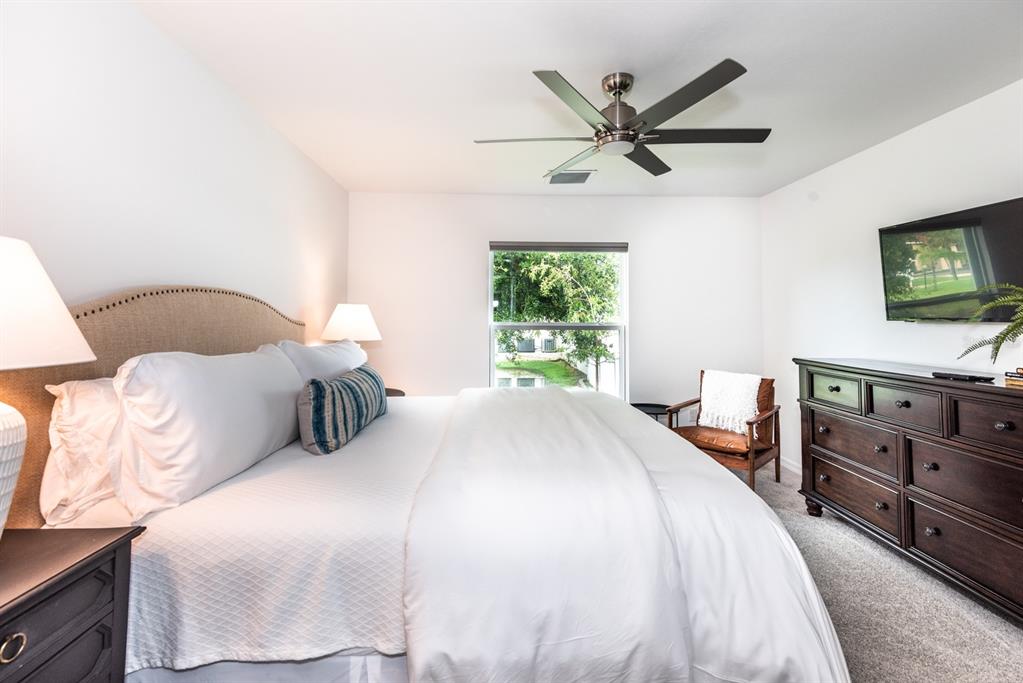 215 Lewis Circle, Unit 111 Punta Gorda, FL 33950 - Photo 29 of 43 a bedroom with a bed and window