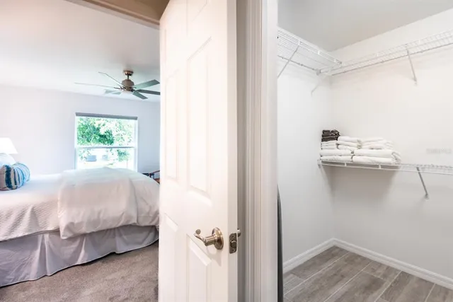 a bedroom with a bed and a table