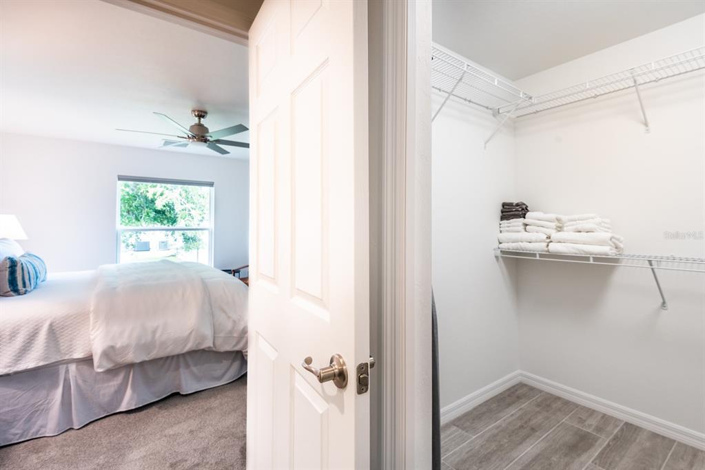 215 Lewis Circle, Unit 111 Punta Gorda, FL 33950 - Photo 34 of 43 a bedroom with a bed and a table