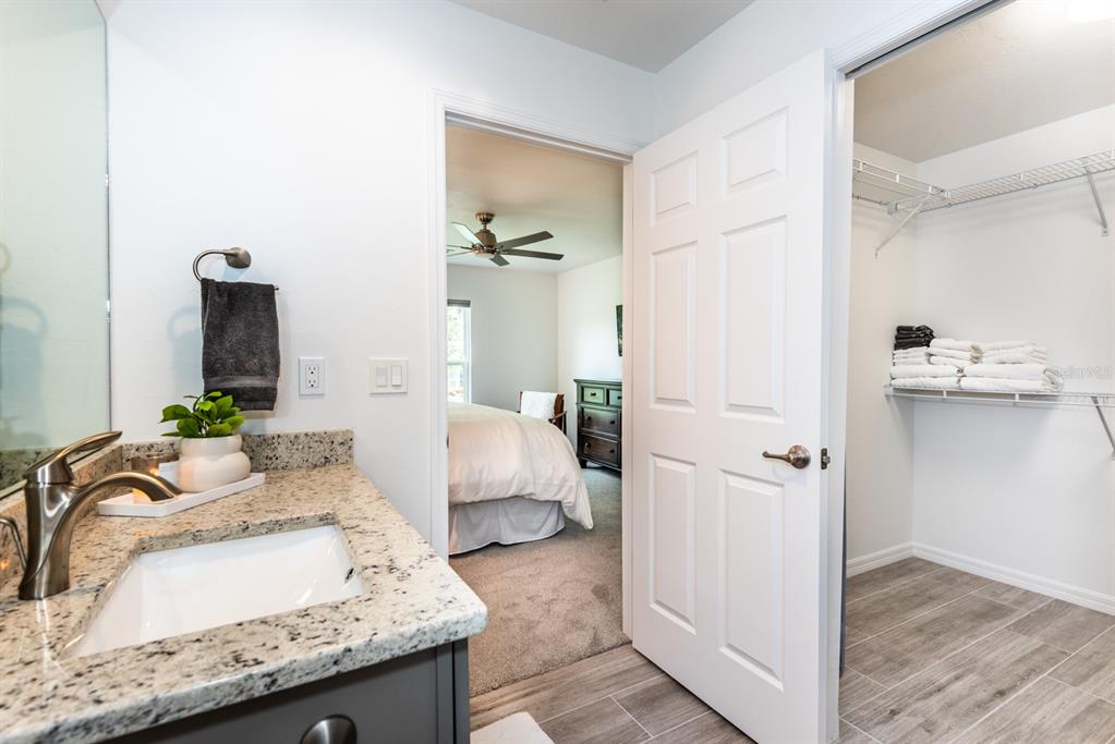 215 Lewis Circle, Unit 111 Punta Gorda, FL 33950 - Photo 38 of 43 a living room with granite countertop furniture and a fireplace