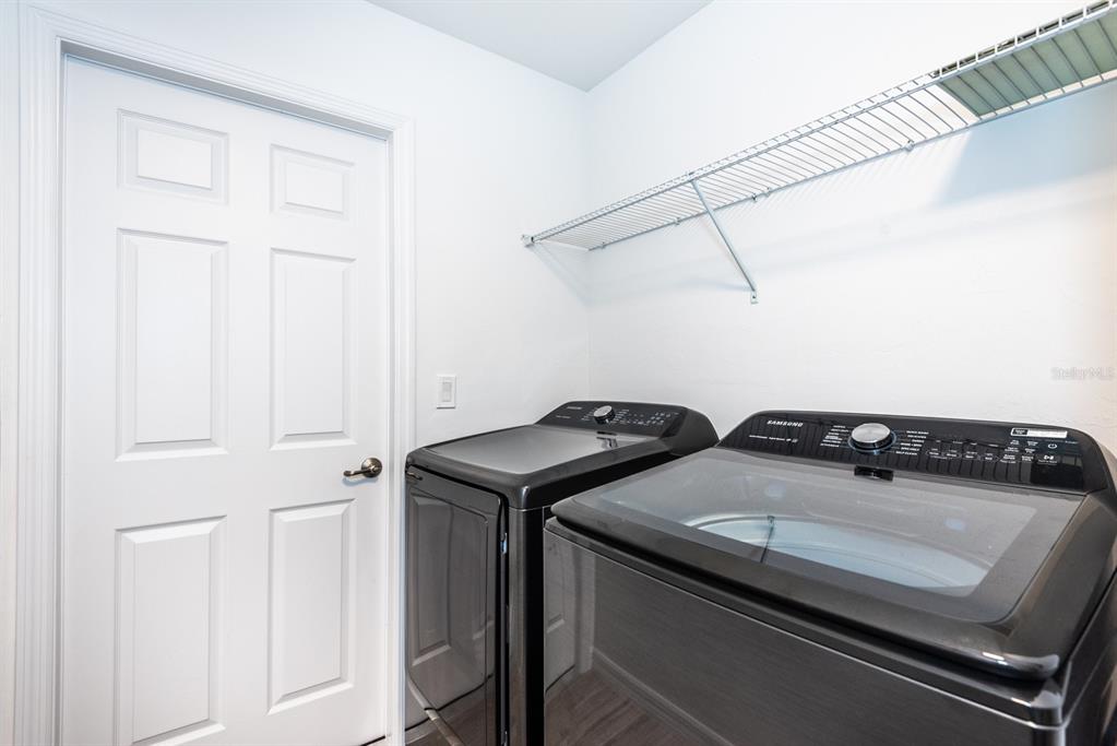 215 Lewis Circle, Unit 111 Punta Gorda, FL 33950 - Photo 40 of 43 a utility room with dryer and washer