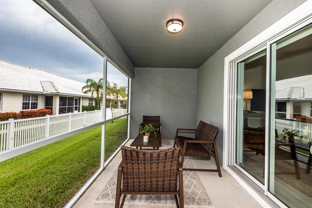 215 Lewis Circle, Unit 111 Punta Gorda, FL 33950 - Photo 41 of 43 a balcony with furniture and garden