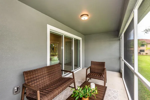 a view of a two chairs in the balcony