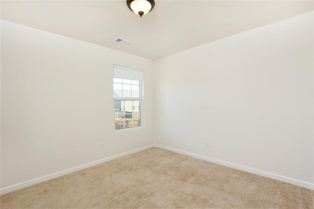 1044 Countess Lane Spring Hill, TN 37174 - Photo 15 of 20 View of third bedroom. Bedrooms are nice size and have nice carpeting. The home is move in ready.
