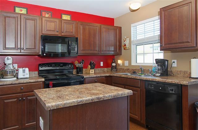 1044 Countess Lane Spring Hill, TN 37174 - Photo 4 of 20 Kitchen features large pantry and easy to keep clean finished wood flooring.