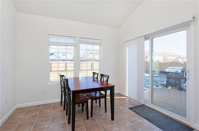 1044 Countess Lane Spring Hill, TN 37174 - Photo 6 of 20 Fantastic Florida room is a great place to relax, features plenty of natural lighting and sliding glass door leading out to the patio.